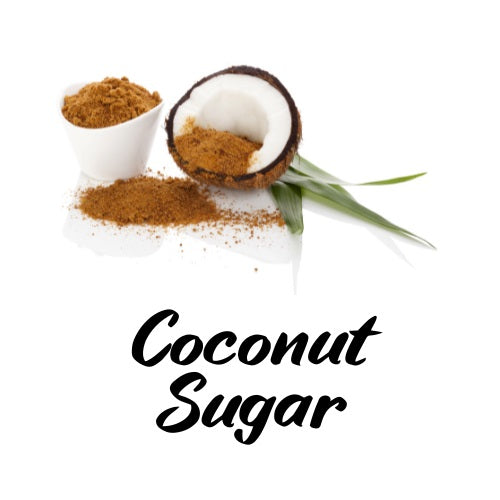 Coconut sugar in a small white bowl and on a white surface with a coconut half, on a white background.