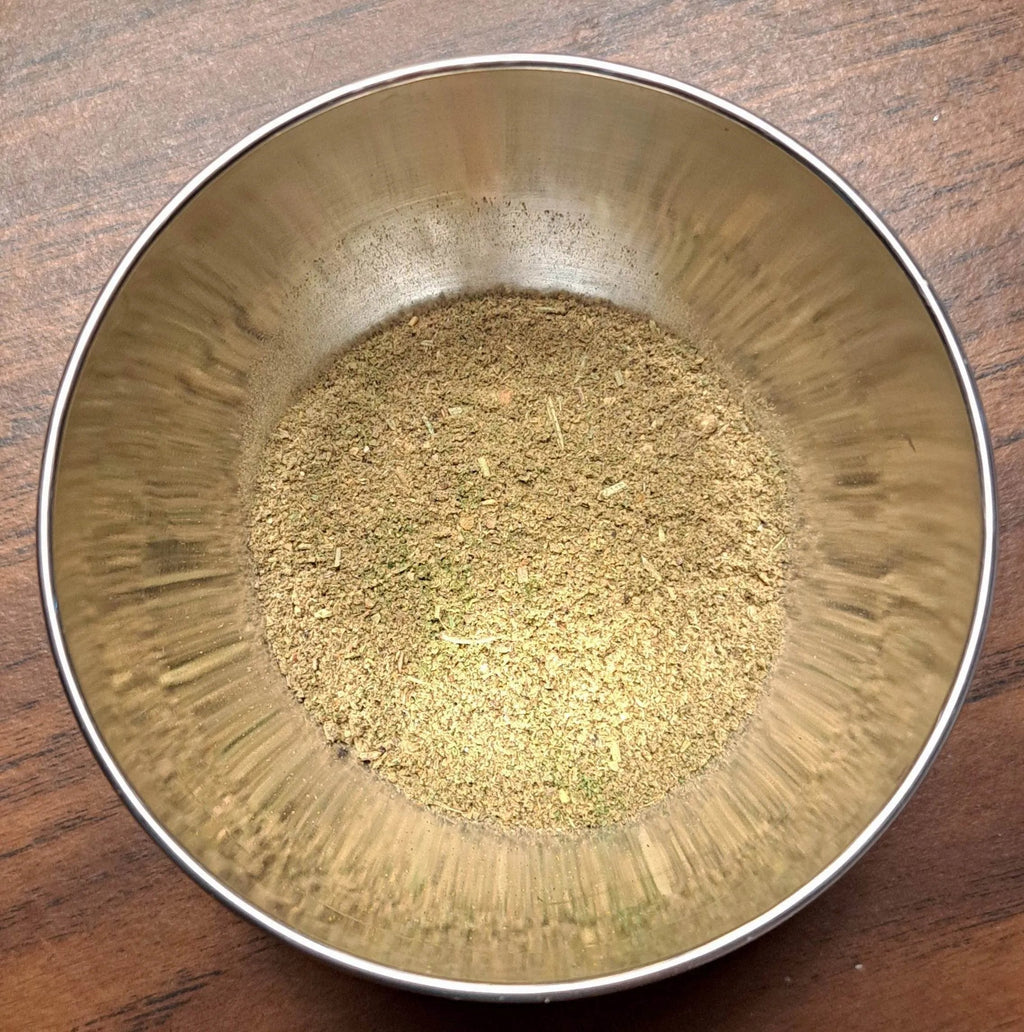 Metal bowl with Fisherman's Blend on a wooden surface