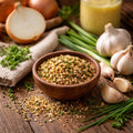 Garlic Onion Bliss Blend in a wooden bowl with onions, garlic, and herbs on a wooden surface