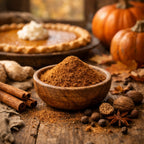 Pumpkin pie with a bowl of pumpkin spice powder on a wooden table with pumpkins and spices.